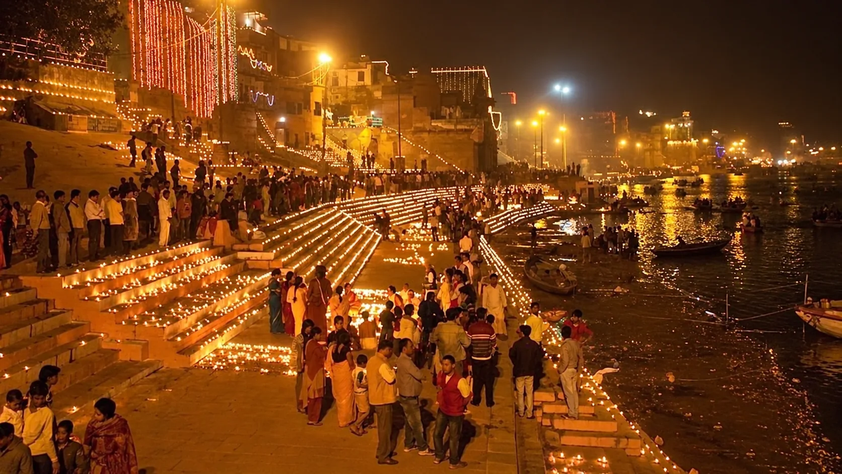 Earthen lamps illuminate the Varanasi ghats beside the Ganges during Dev Diwali