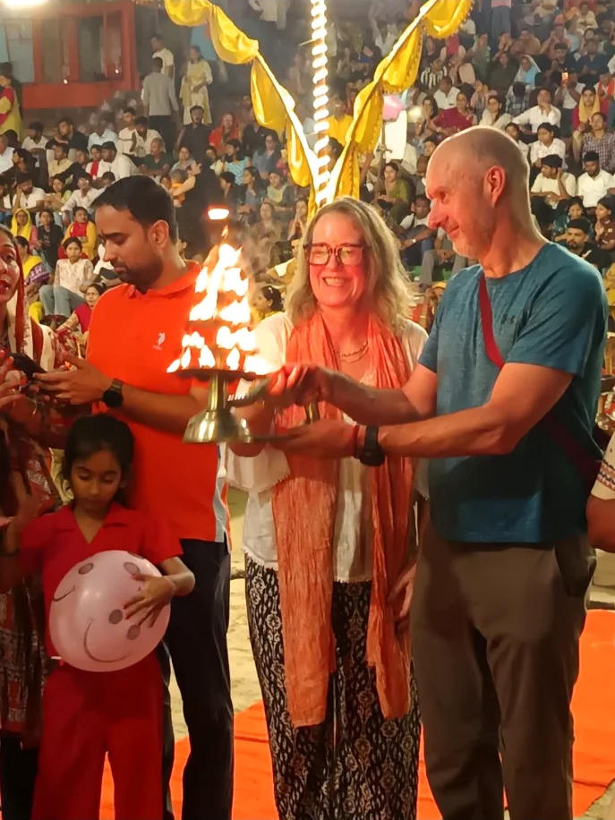 International travellers taking part respectfully in the evening Ganga Aarti ceremony in Varanasi