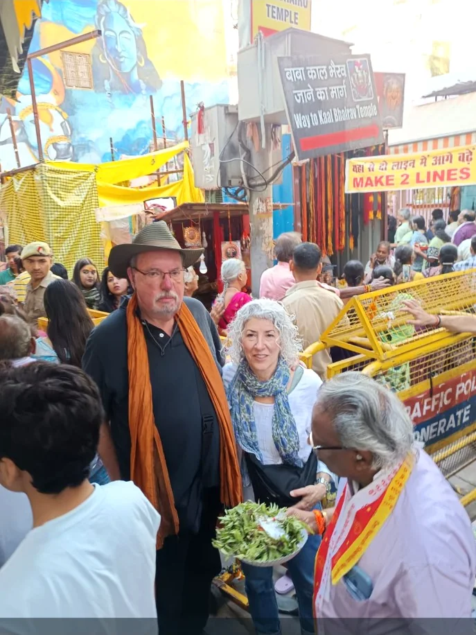 International travellers visiting the Kal Bhairav temple area with local guidance in Varanasi