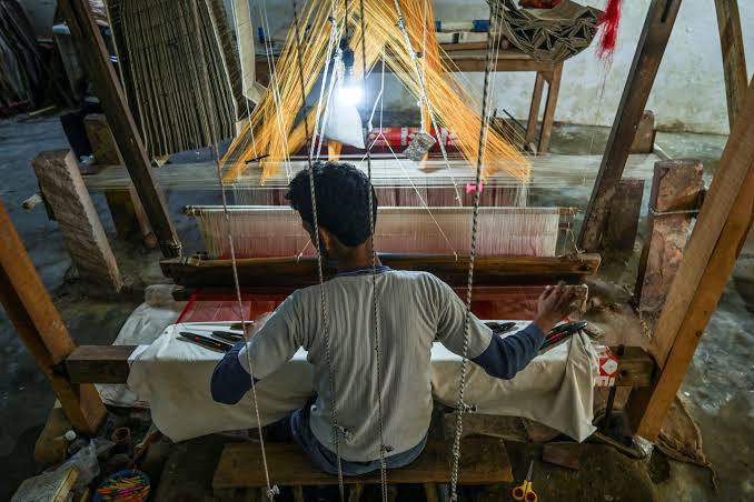 Banarasi silk artisan working at a traditional handloom in Varanasi