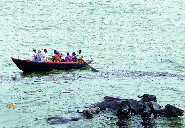 Travellers enjoying a private sunrise boat experience on the Ganges in Varanasi